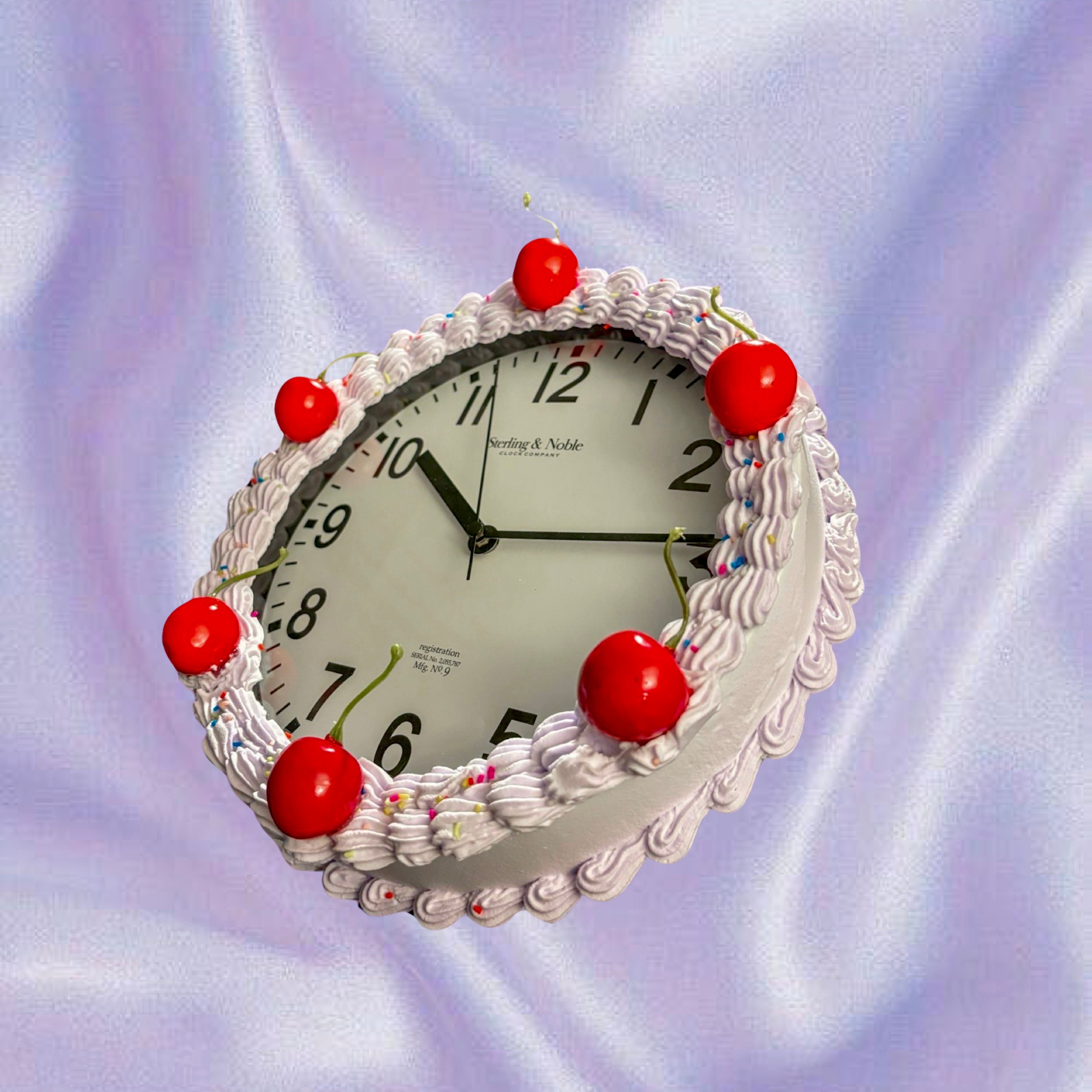 A closeup shot of a cake shaped like a clock Stock Photo - Alamy